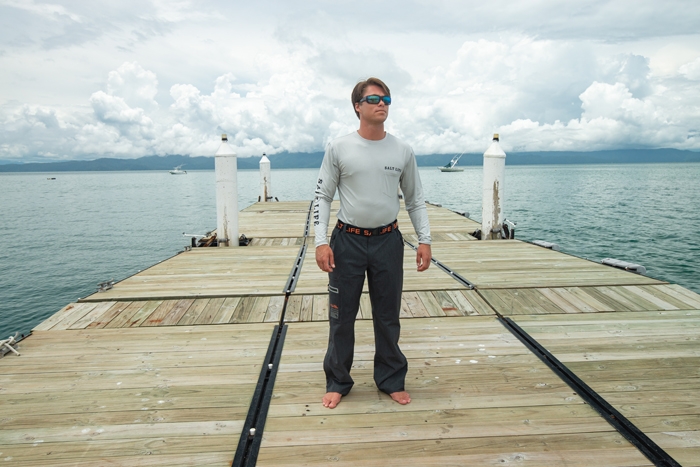 Ryder Devoe on a dock wearing Salt Life Thunder Mens Pant SLM4057 Black 