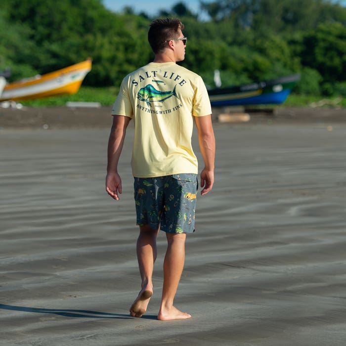 Ryder Devoe walking on the beach wearing wearing Salt Life Taco Night Aquatrunks SLM4088 Charcoal 