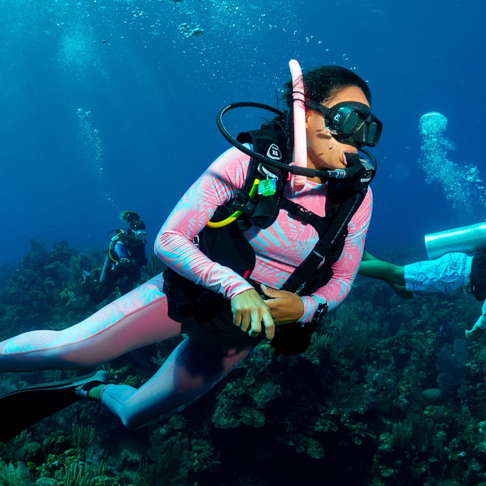 Stacey Baker diving wearing Salt Life Jungle Vibes Legging SLJ4105 Ocean Coral Right