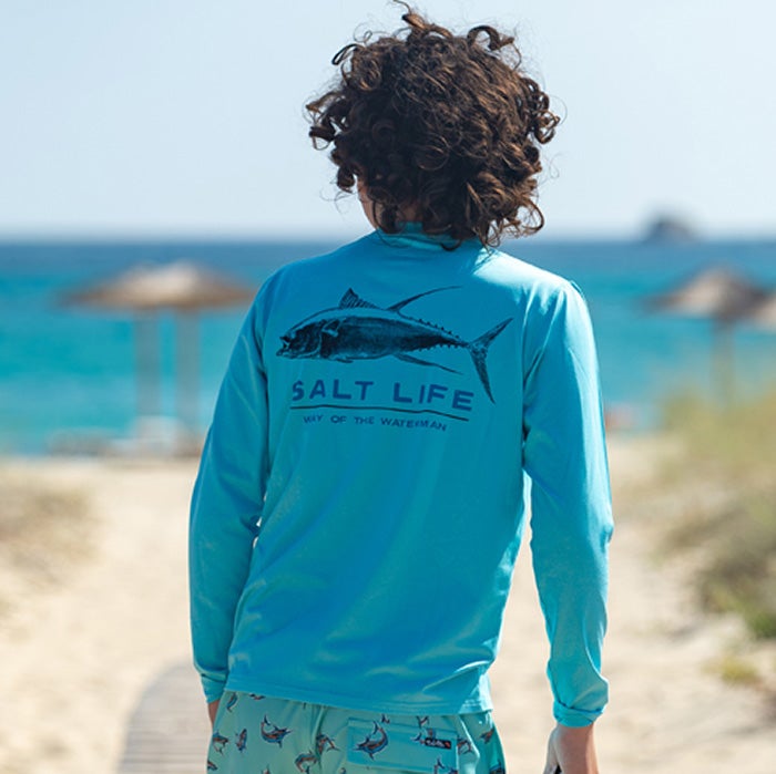 Kid wearing Salt Life Deep Ventures Youth long sleeve SLX Tee SLY715 turquoise heather Back