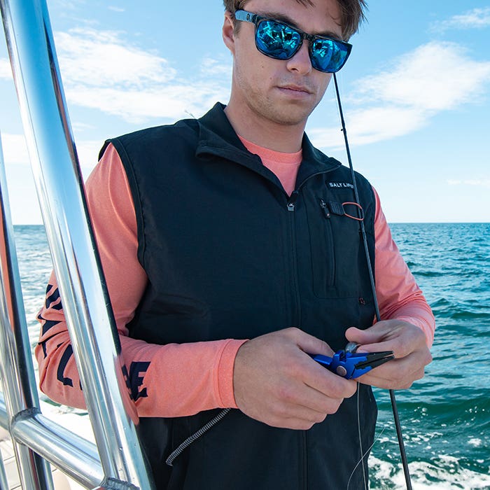 Ryder Devoe on boat wearing Salt Life Venture Mens Vest SLM5002 Black Front 