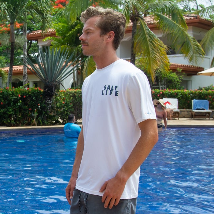 Max Fleming in pool wearing Salt Life Kahuna Tuna SLX Mens Tee SLM6295 White Front